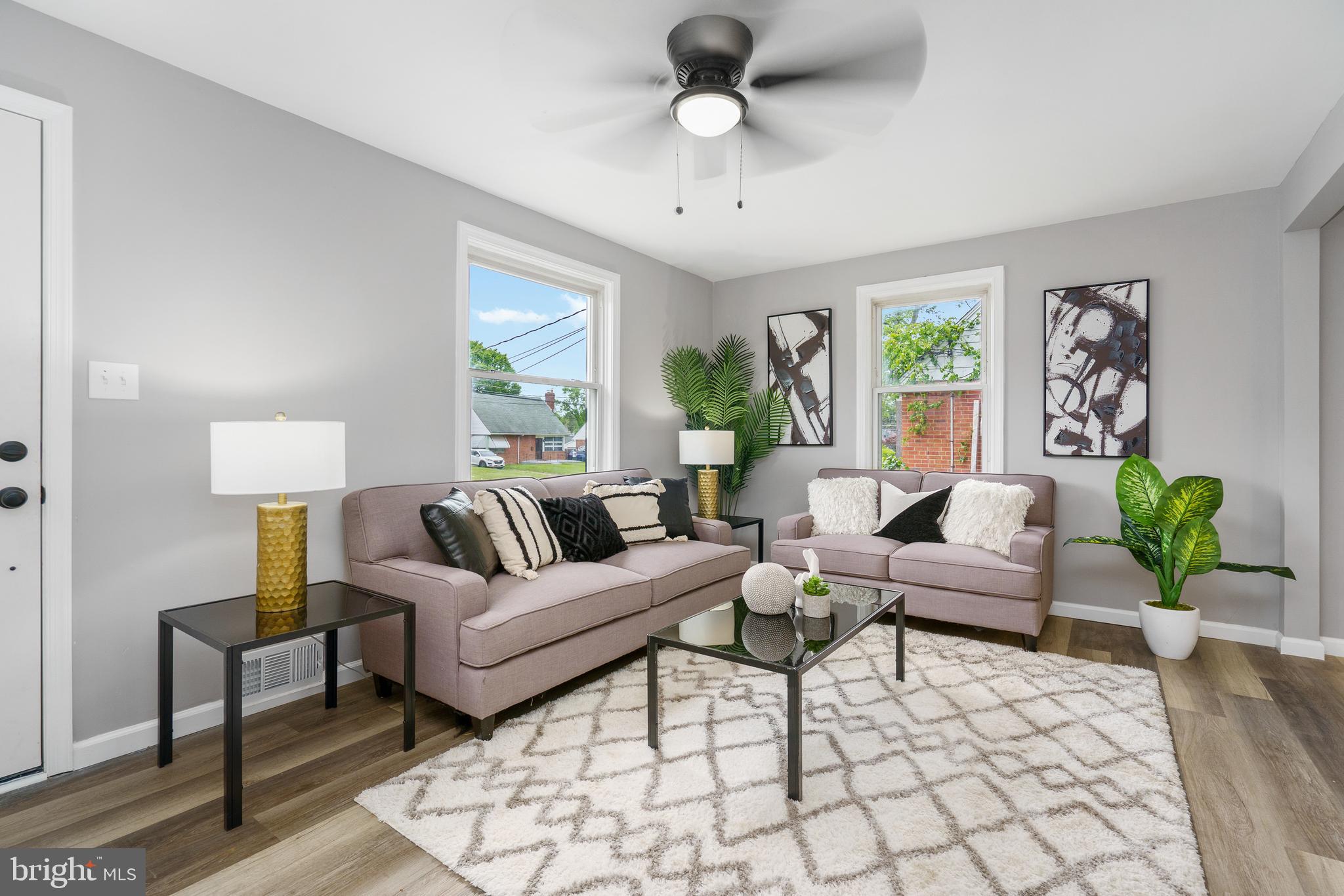 3531 Milford Mill Road Baltimore, MD 21244 - Photo 6 of 49 a living room with furniture and a large window