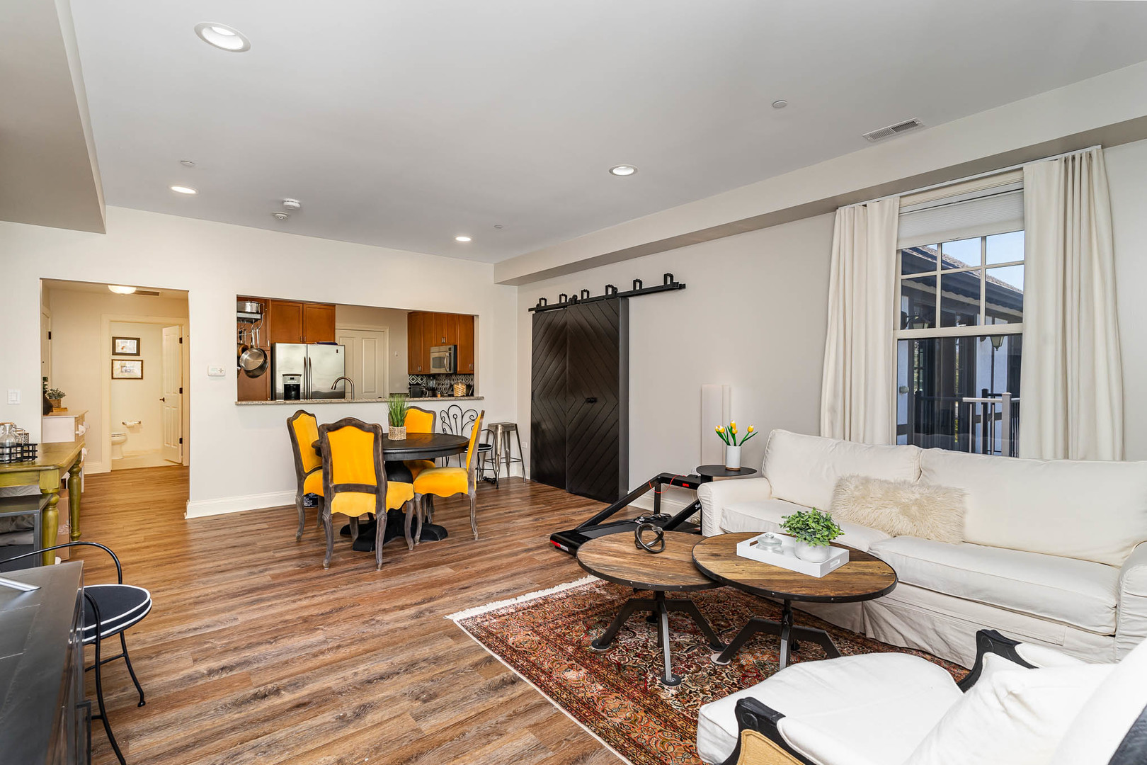 720 Green Bay Road, Unit 2E Winnetka, IL 60093 - Photo 6 of 13 a living room with furniture kitchen view and a large window