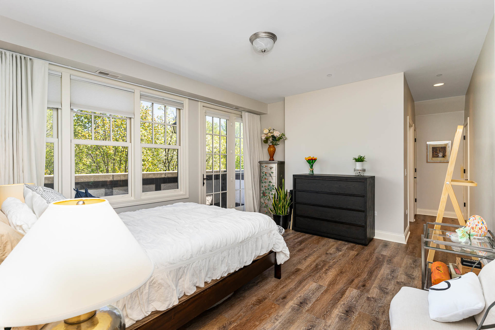 720 Green Bay Road, Unit 2E Winnetka, IL 60093 - Photo 8 of 13 a bedroom with a bed and wooden floor