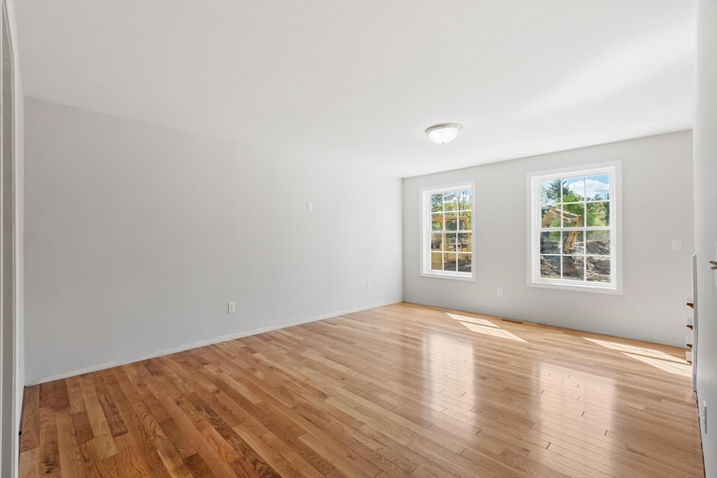22 Benoit Avenue Pelham, NH 03076 - Photo 26 of 42 a view of an empty room with wooden floor and a window
