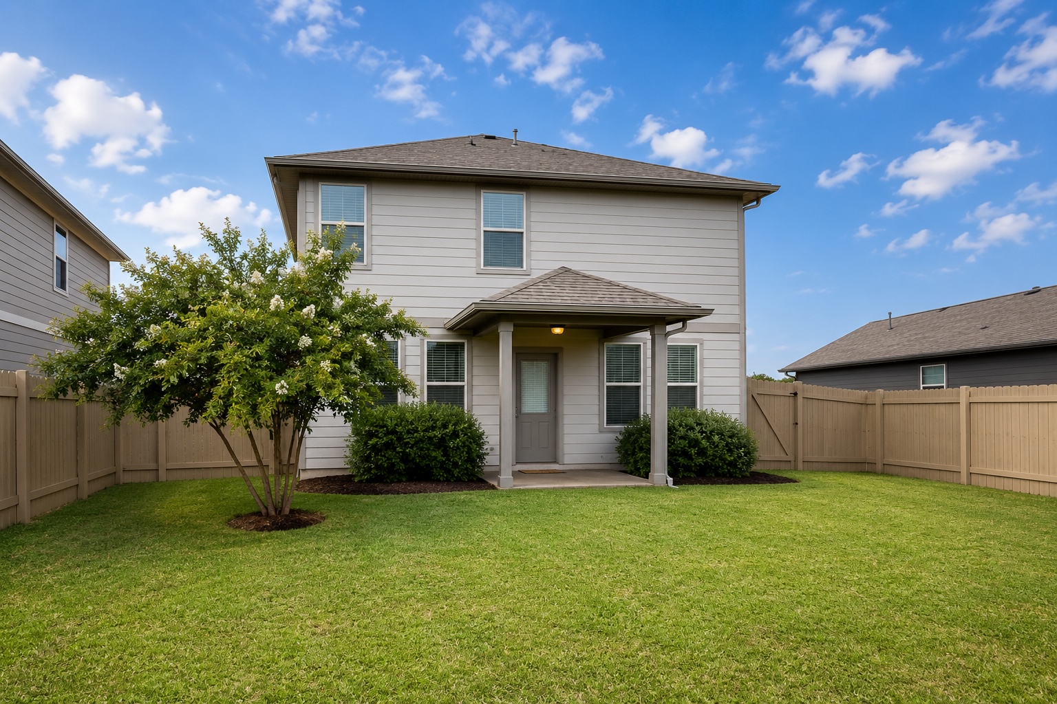 508 Rearing Mare Pass Georgetown, TX 78626 - Photo 21 of 24 A well-maintained fenced yard frames this two-story residence with a welcoming covered porch.
