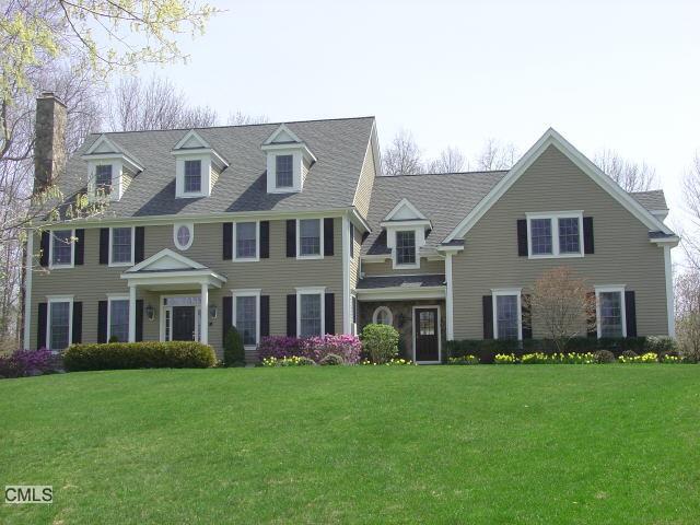 12 Oak Knoll Road Ridgefield, CT 06877 - Photo 1 of 1 a front view of house with yard and green space
