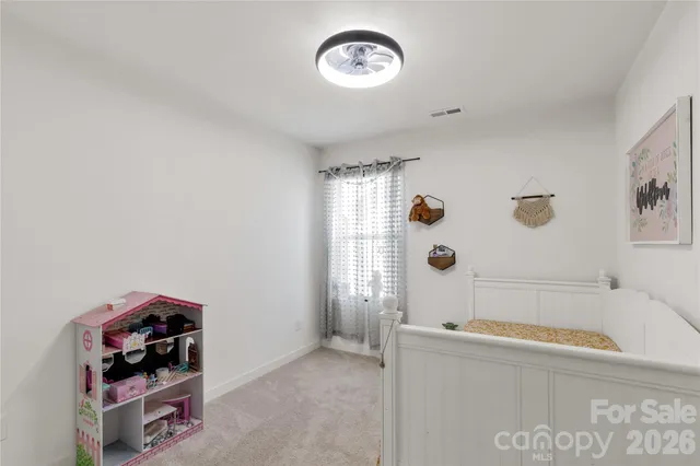 a bathroom with a tub and a window