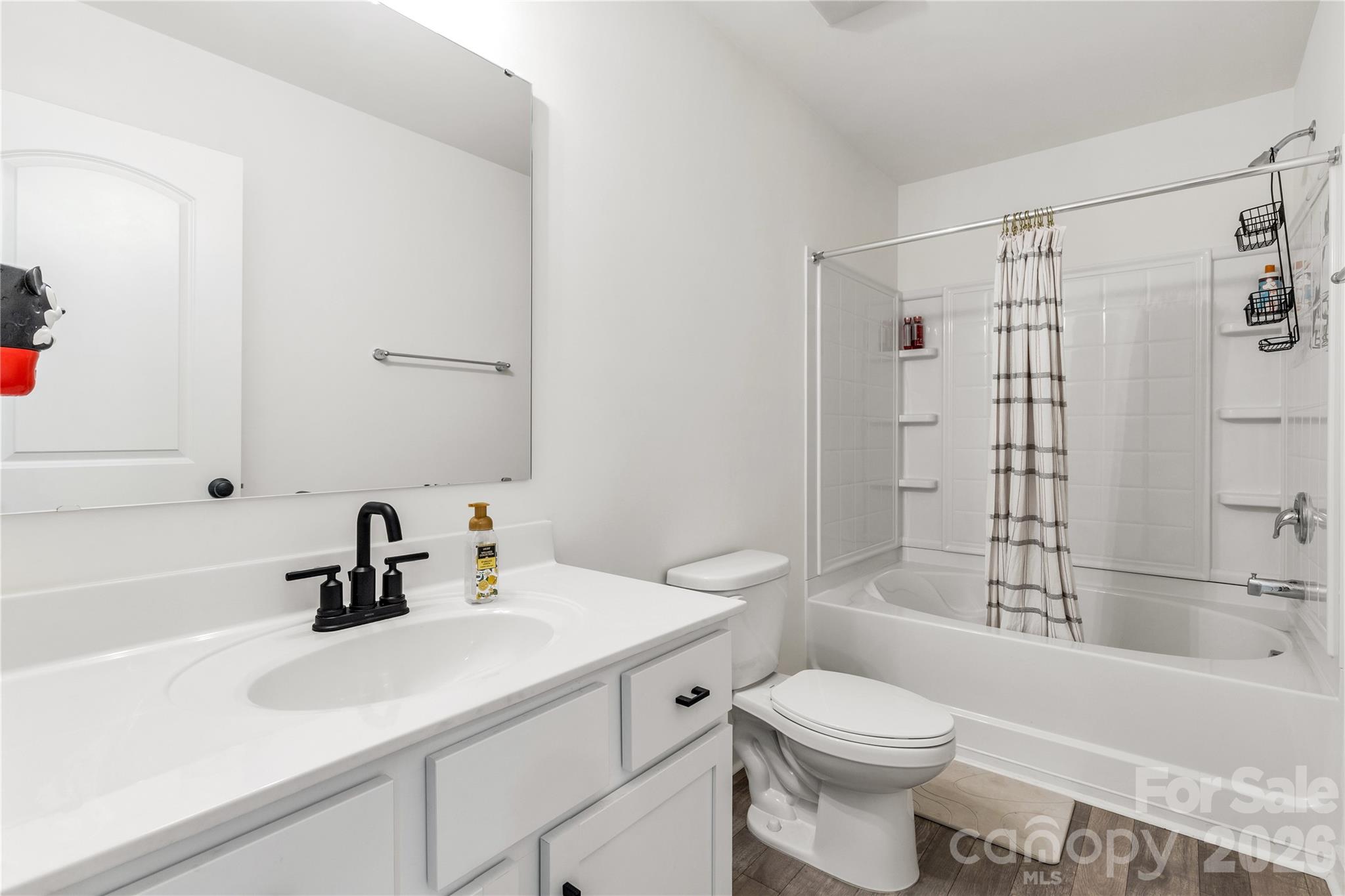 11117 Argosy Drive Lancaster, SC 29720 - Photo 23 of 37 a bathroom with a sink toilet and shower