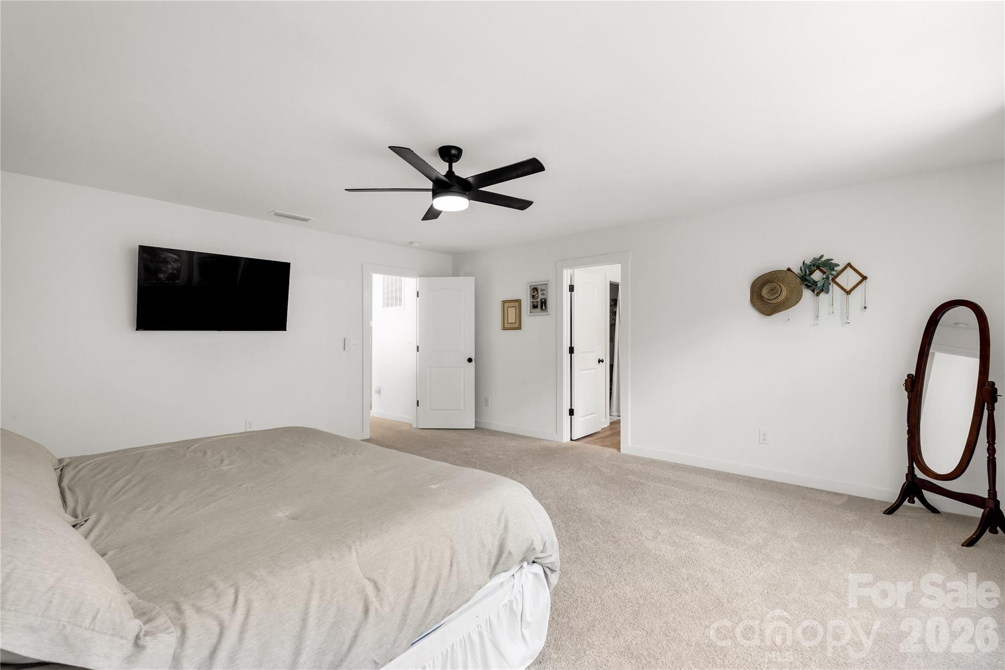 11117 Argosy Drive Lancaster, SC 29720 - Photo 26 of 37 a spacious bedroom with a bed and a flat screen tv