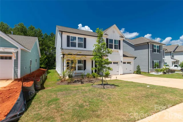 a front view of house with outdoor seating yard