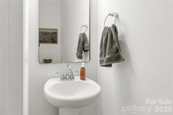 a bathroom with a sink and mirror