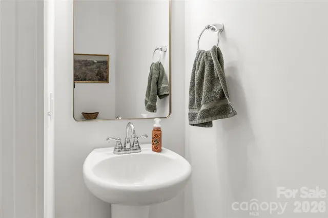 a bathroom with a sink and mirror