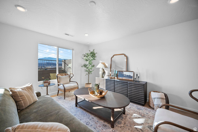 2123 Wolverine Way, Unit 2437 Washington, UT 84780 - Photo 24 of 40 Spacious interior featuring a large window with mountain scenery, recessed ceiling lighting, and light wood-finish flooring