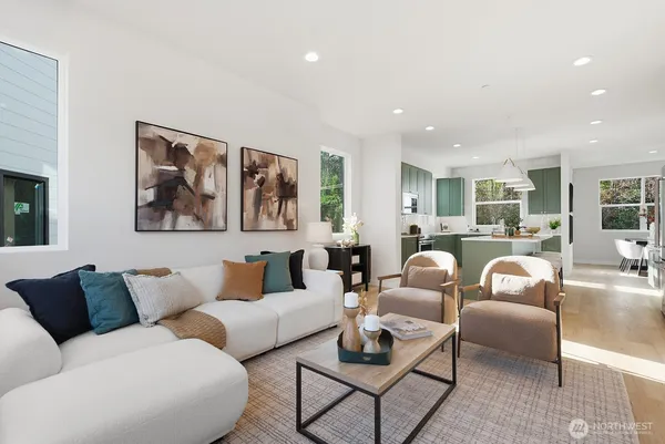 a living room with furniture and glass windows