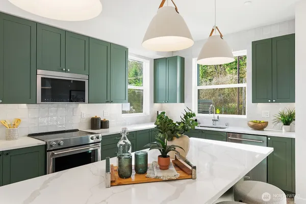 a kitchen with a stove and a sink