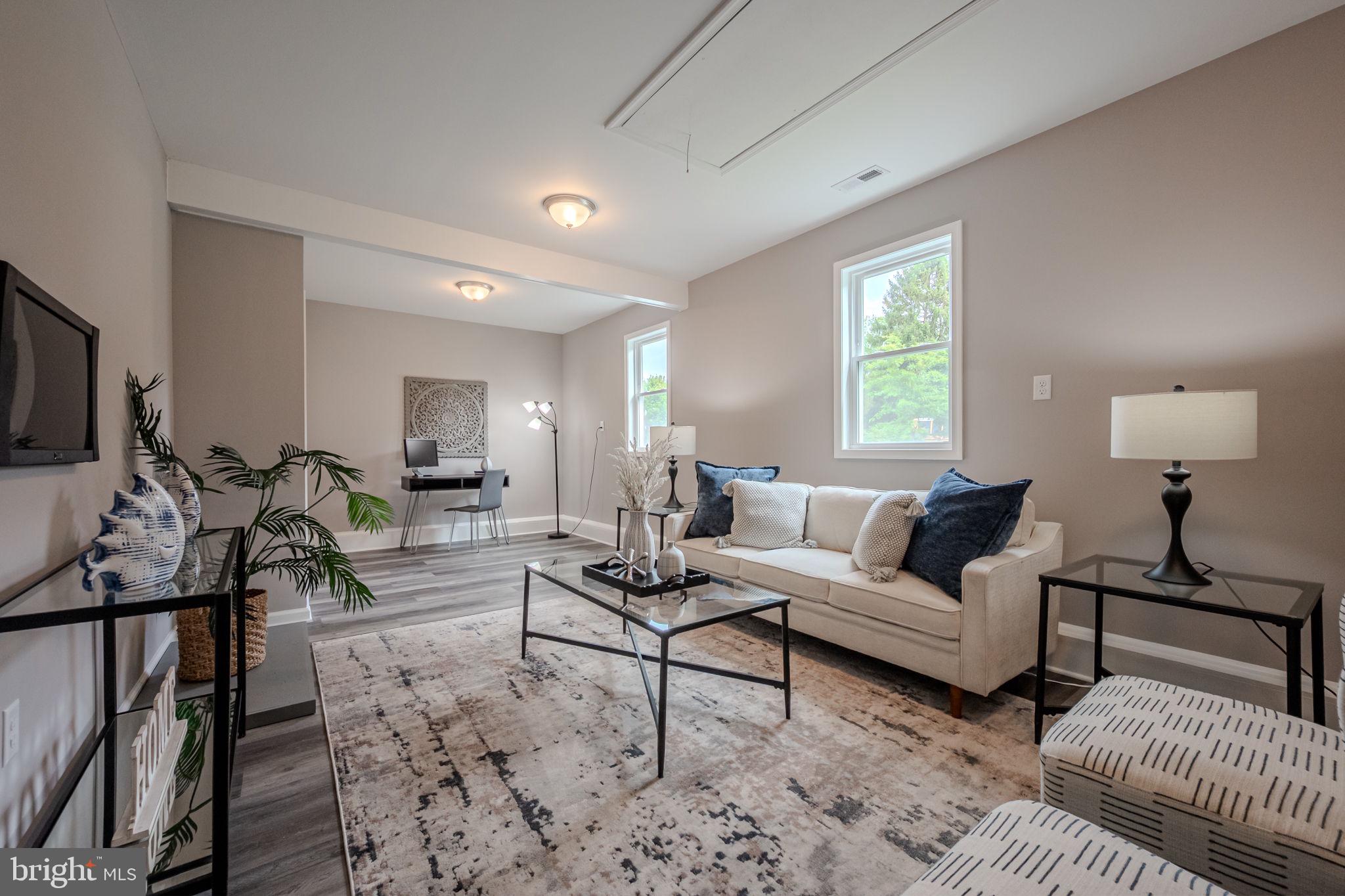 23110 Old Fairlee Road Chestertown, MD 21620 - Photo 14 of 29 a living room with furniture a flat screen tv and a window