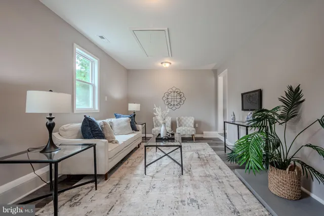 a bathroom with a granite countertop sink toilet and mirror