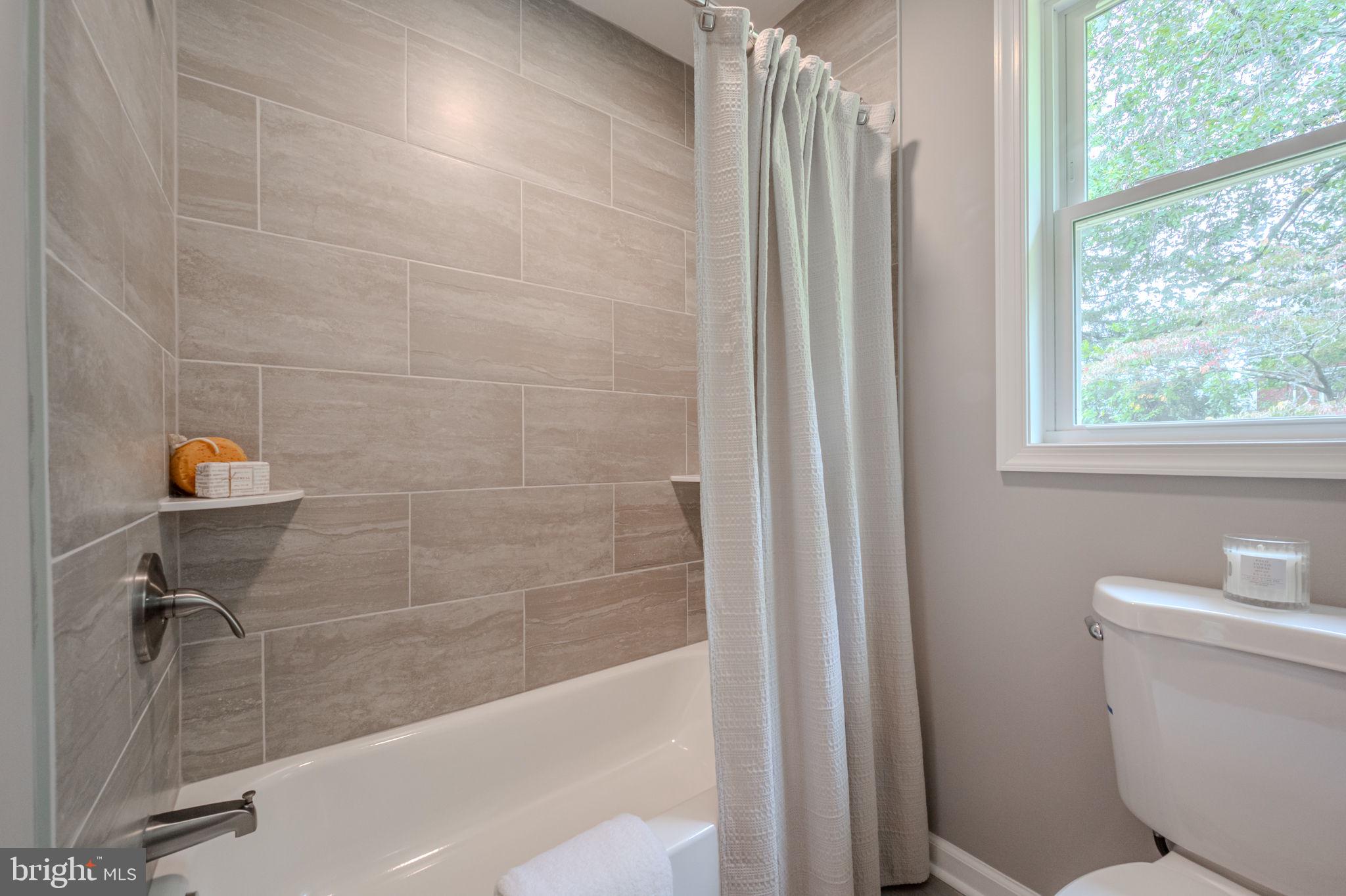 23110 Old Fairlee Road Chestertown, MD 21620 - Photo 18 of 29 a bathroom with a shower and a toilet