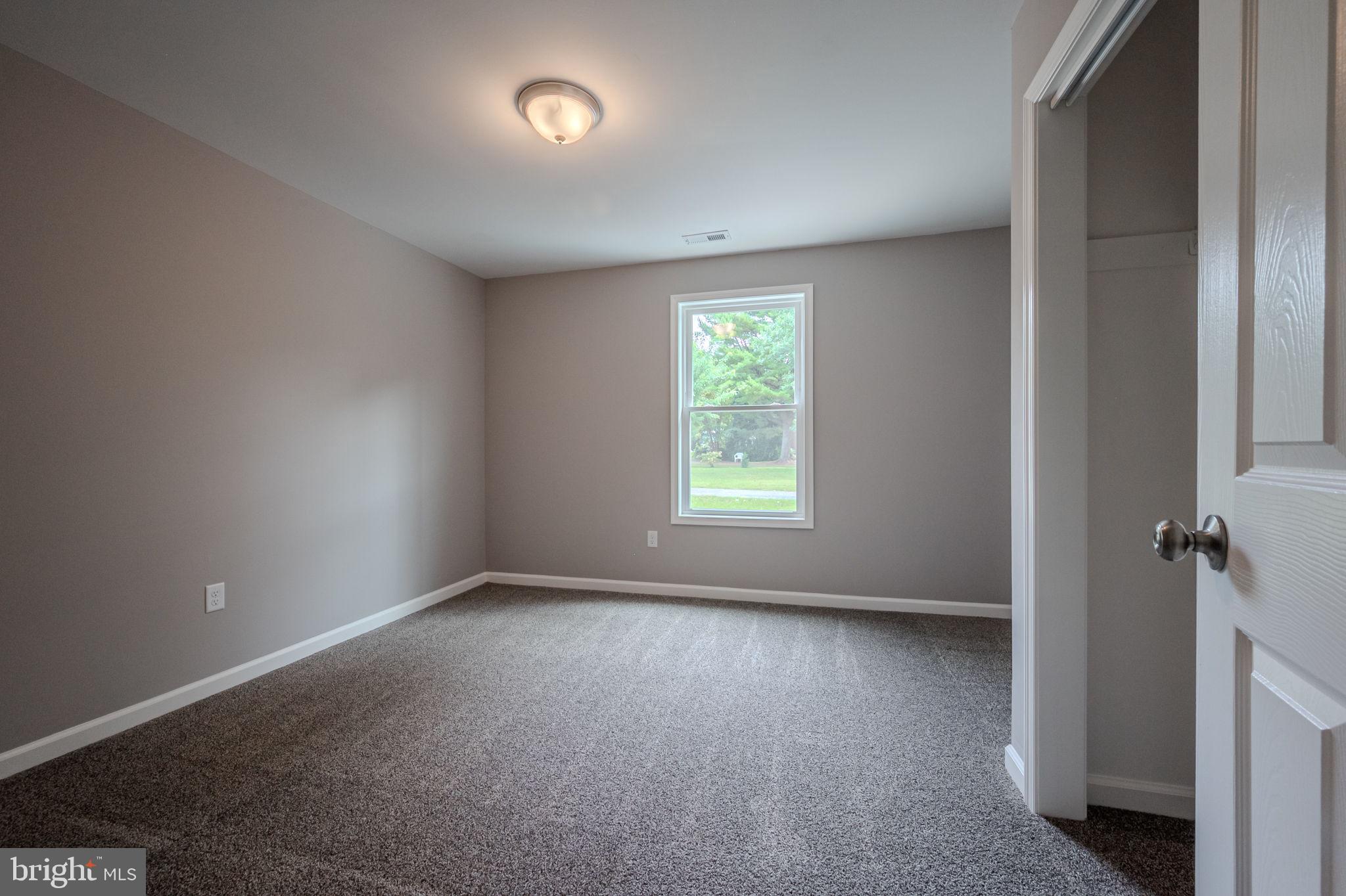 23110 Old Fairlee Road Chestertown, MD 21620 - Photo 24 of 29 an empty room with windows and closet