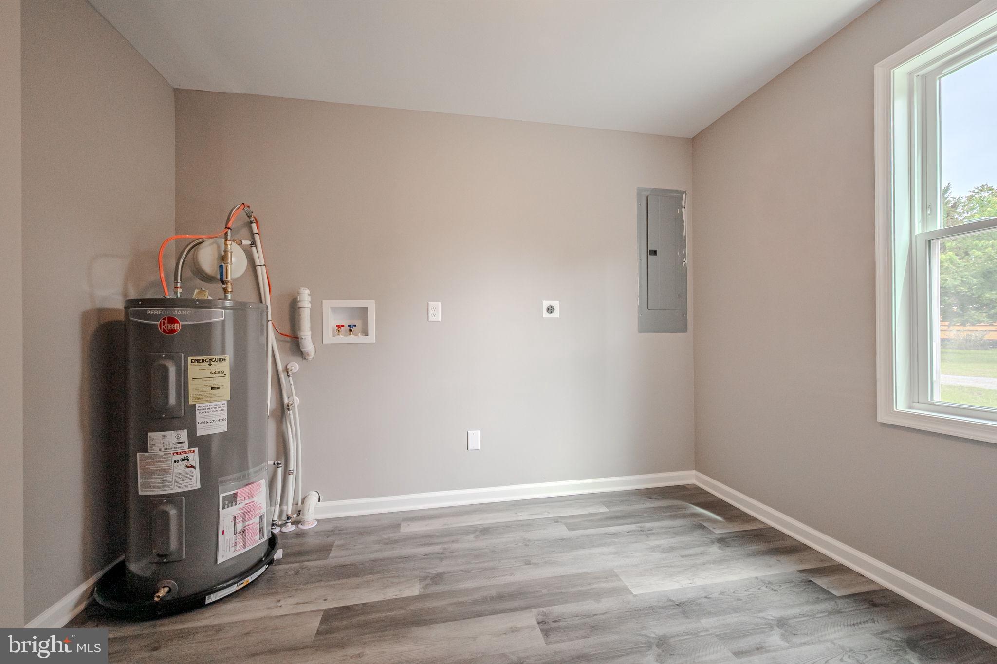 23110 Old Fairlee Road Chestertown, MD 21620 - Photo 25 of 29 a view of empty room with wooden floor and fan
