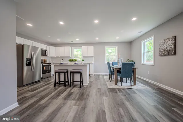 a kitchen with a table and chairs in it