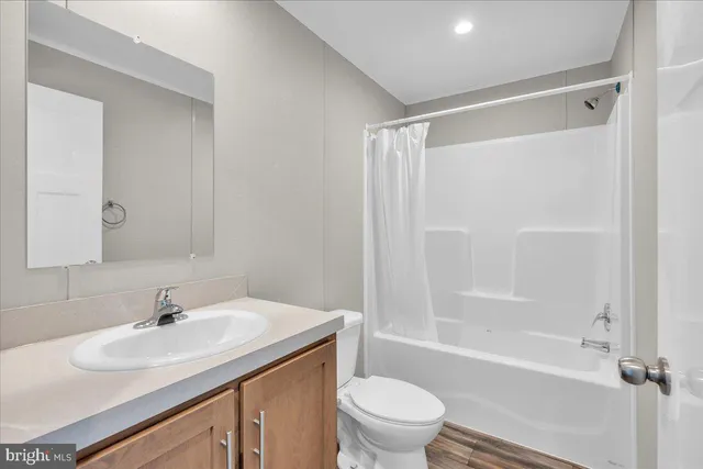 a bathroom with a sink toilet and a bathtub