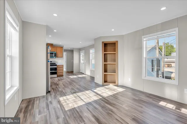 a view of livingroom with furniture and front door