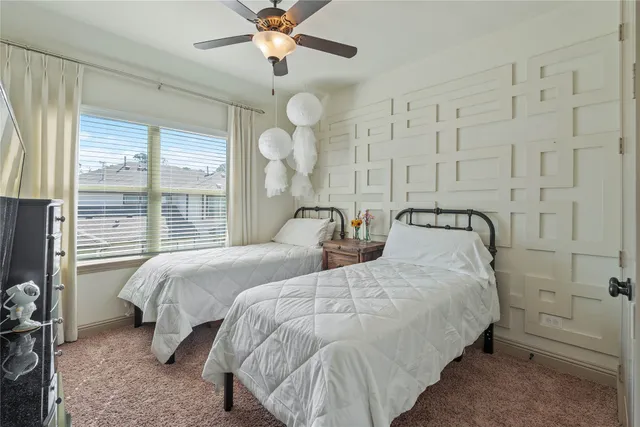 a bedroom with bed and window