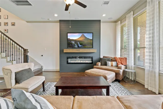 a living room with furniture a rug and a fireplace