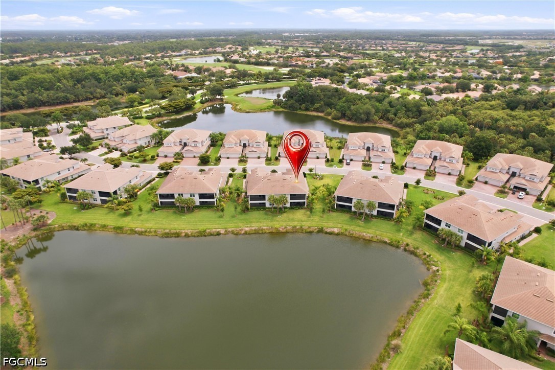3751 Pebblebrook Ridge Court, Unit 101 Fort Myers, FL 33905 - Photo 46 of 48 an aerial view of residential houses with outdoor space and swimming pool