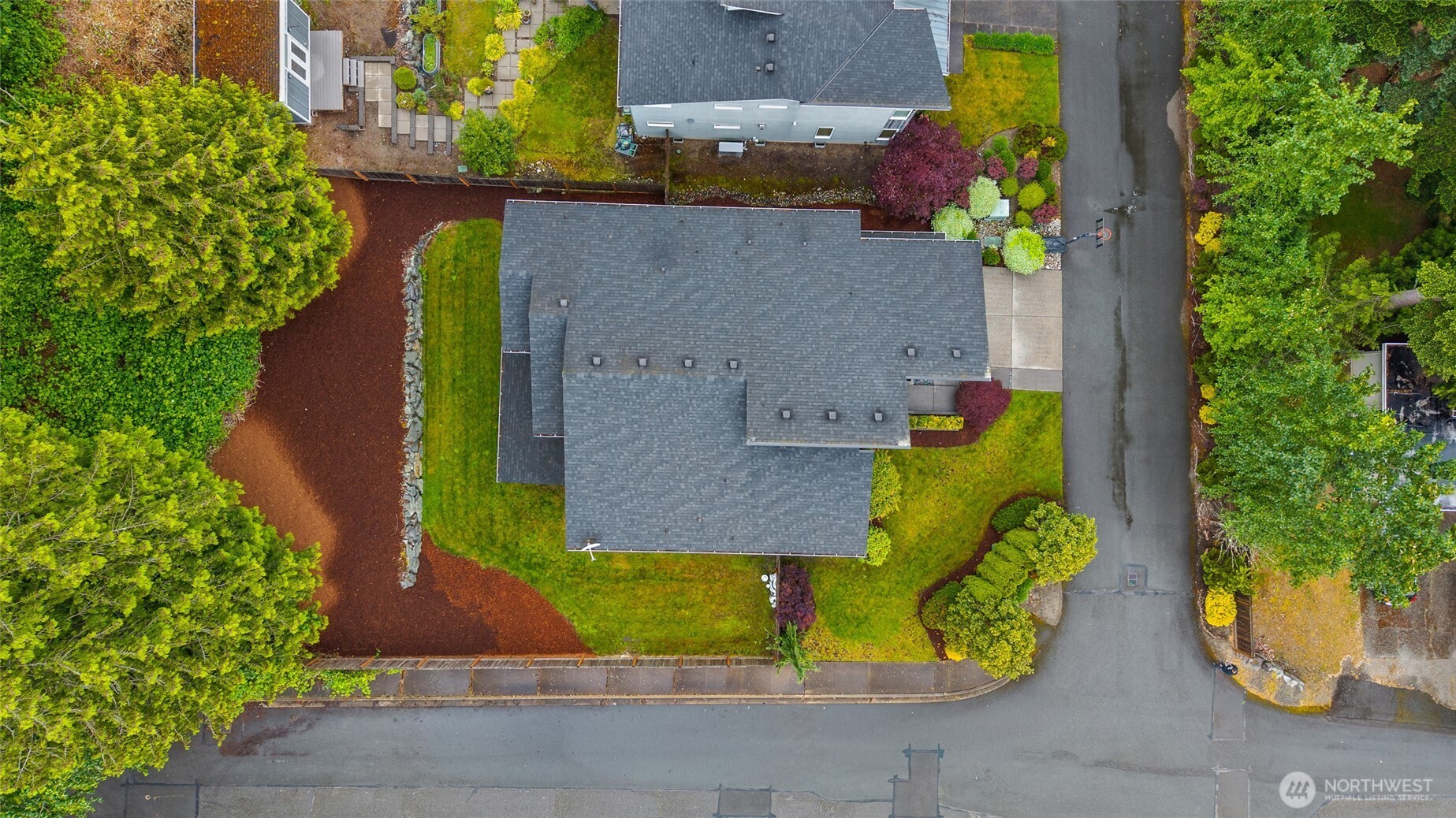 22326 2nd Place Southeast Bothell, WA 98021 - Photo 38 of 40 an aerial view of a house with large trees and playing ground