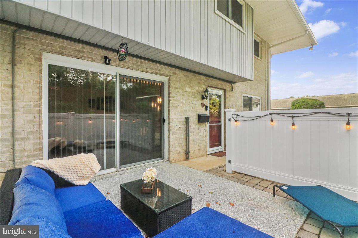 1518 Manley Road, Unit B3 West Chester, PA 19382 - Photo 17 of 23 New epoxy/paver patio with vinyl fence