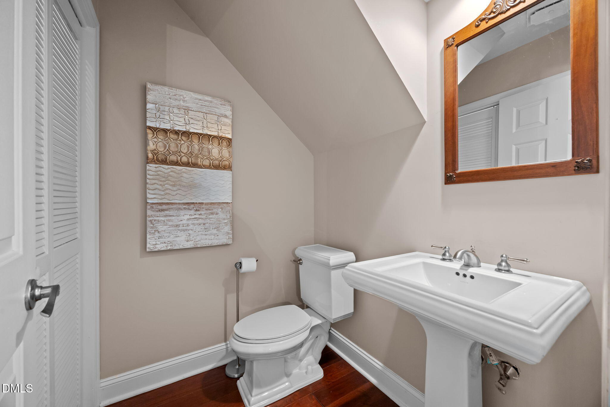 5530 Forest Oaks Drive Raleigh, NC 27609 - Photo 6 of 12 a bathroom with a sink toilet and a mirror