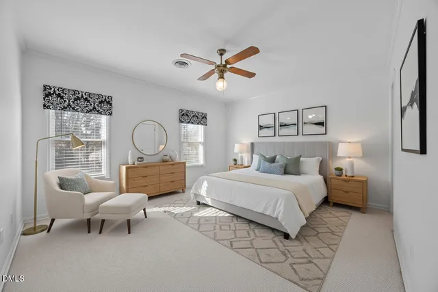 a bedroom with bed and a chandelier