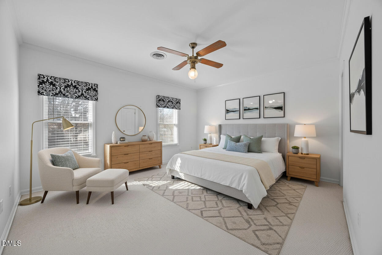 5530 Forest Oaks Drive Raleigh, NC 27609 - Photo 10 of 12 a bedroom with bed and a chandelier