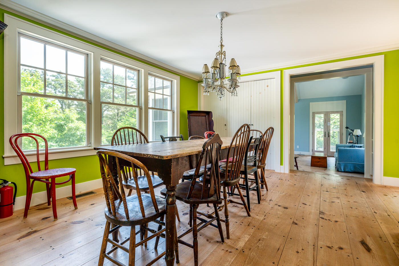 9 Towhee Lane Truro, MA 02666 - Photo 20 of 62 a view of a dining room with furniture a chandelier and wooden floor
