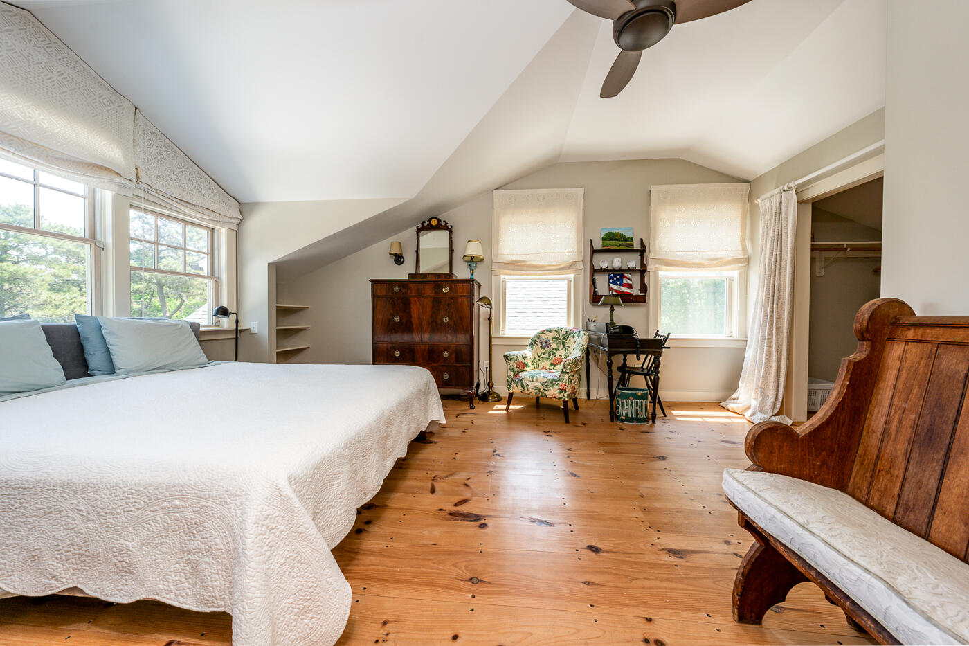 9 Towhee Lane Truro, MA 02666 - Photo 35 of 62 a spacious bedroom with a bed a couch and large windows
