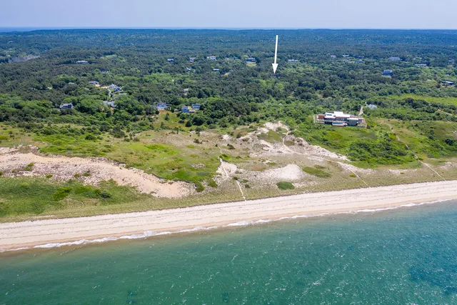 a living room with furniture a table and a large window