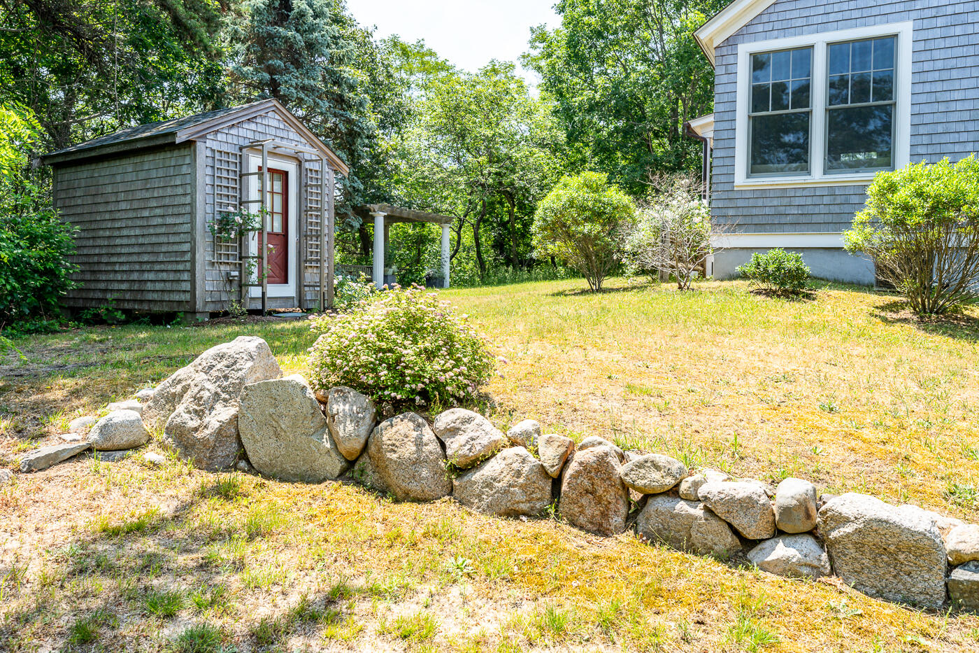 9 Towhee Lane Truro, MA 02666 - Photo 53 of 62 a view of a house with a yard and sitting area