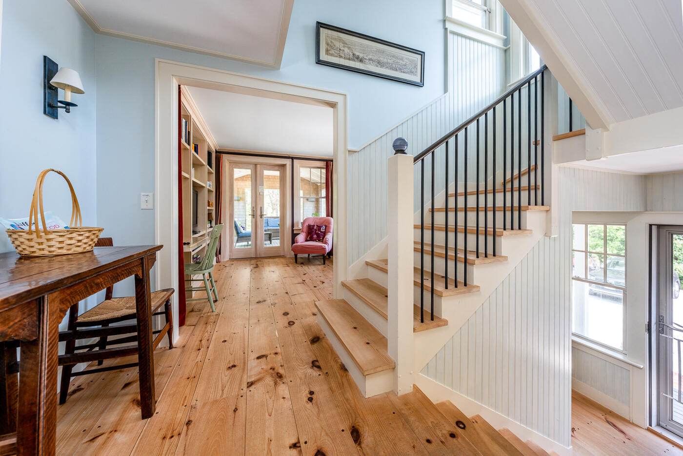 9 Towhee Lane Truro, MA 02666 - Photo 8 of 62 a view of a hallway to a livingroom with wooden floor and furniture