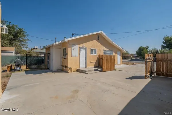 a view of a livingroom with furniture and cabinet