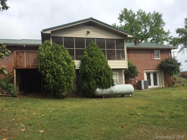4665 Highway 9 Mill Spring, NC 28756 - Photo 2 of 12 a view of a house with backyard and garden