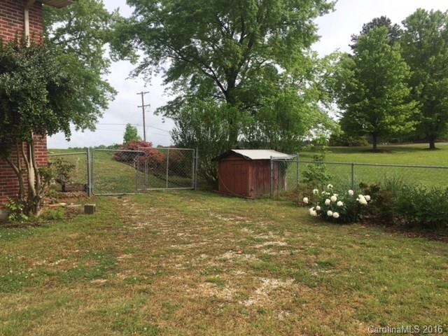 4665 Highway 9 Mill Spring, NC 28756 - Photo 12 of 12 a backyard of a house with lots of green space