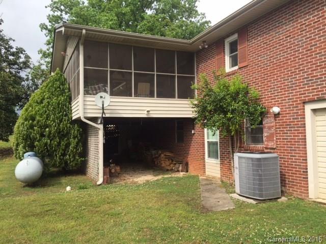 4665 Highway 9 Mill Spring, NC 28756 - Photo 8 of 12 a front view of a house with a yard