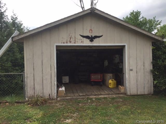 4665 Highway 9 Mill Spring, NC 28756 - Photo 10 of 12 a front view of a house with garden