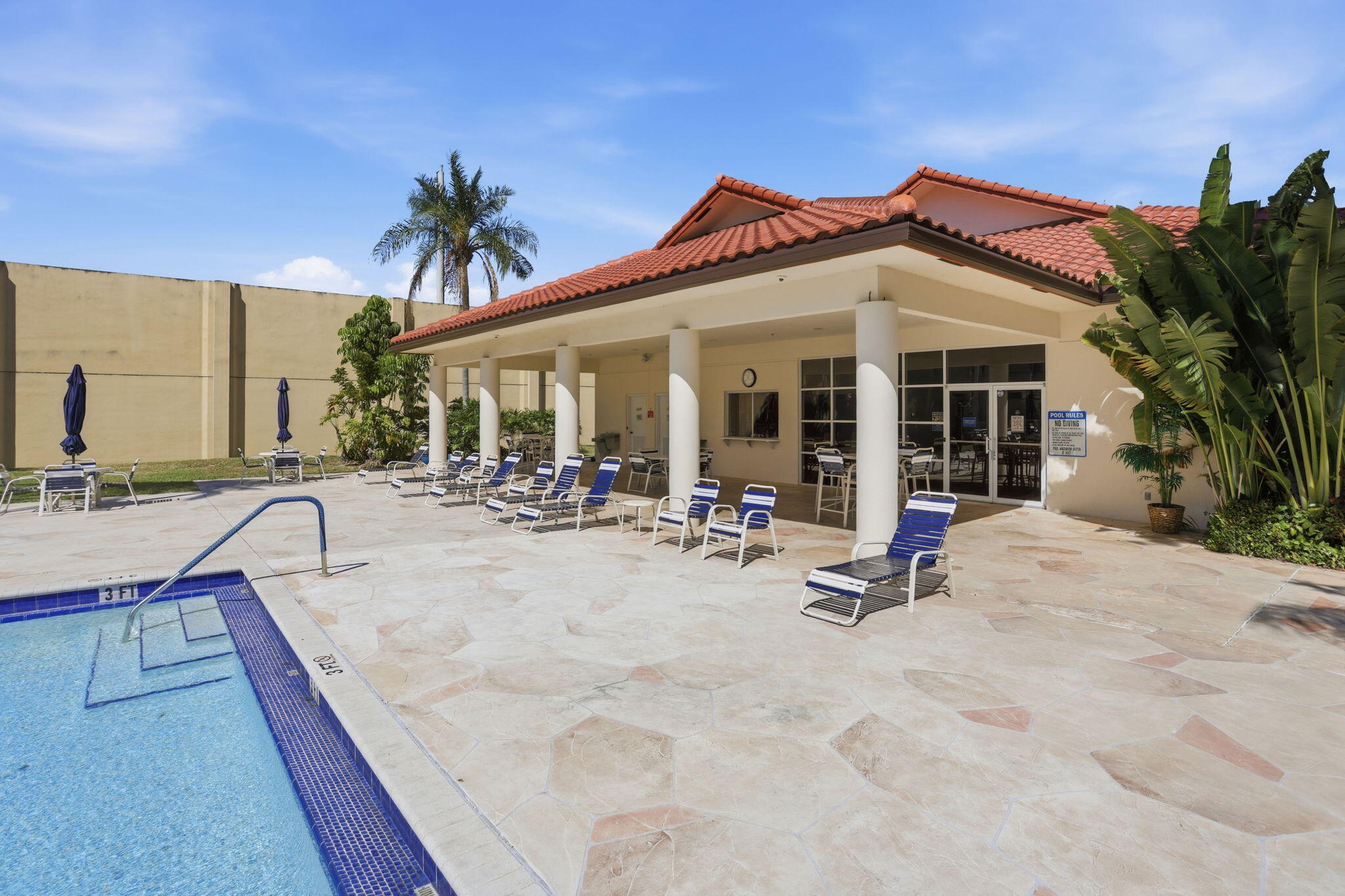 440 Northwest 67th Street, Unit 201 Boca Raton, FL 33487 - Photo 39 of 40 Pool and Shaded Patio Area