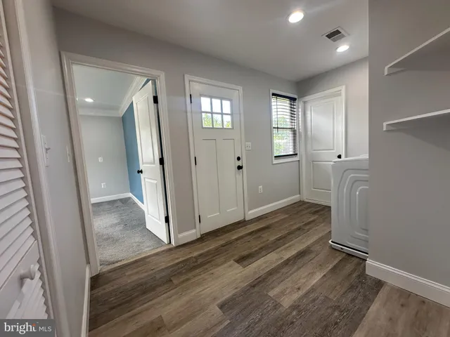 a view of a utility room with closet area