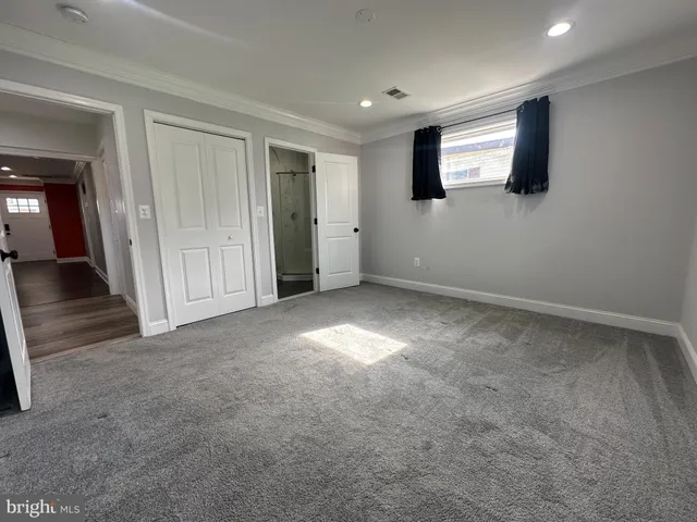 a bathroom with a toilet a sink and shower