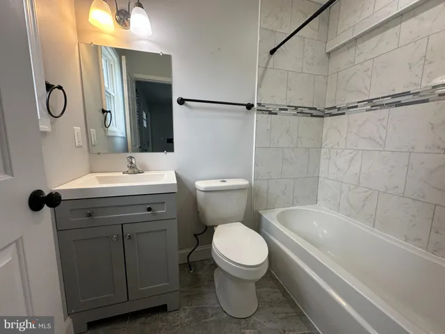 a view of a house with a big yard and potted plants