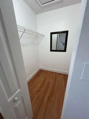 a view of storage and utility room with racks on the wall