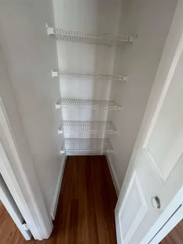 a view of wooden floor in a bathroom