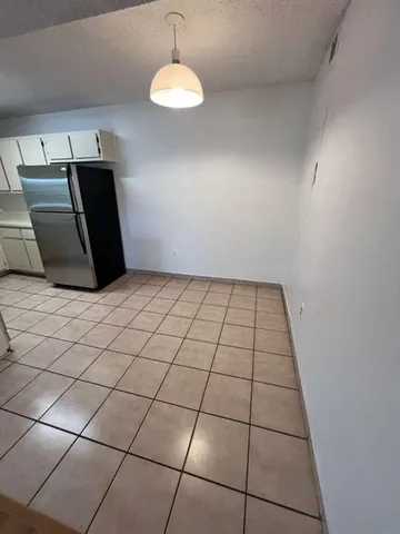 a view of a livingroom with an empty space and a sink