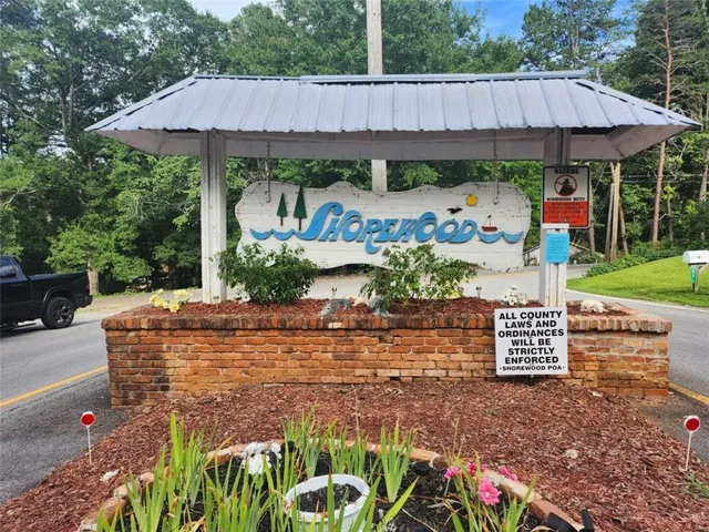 a view of a patio with table and chairs under an umbrella