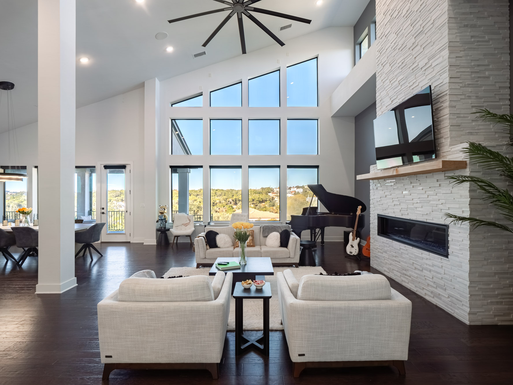 14900 Copper Ridge Lane Austin, TX 78734 - Photo 6 of 39 Living room featuring plenty of natural light, a fireplace, dark wood finished floors, high vaulted ceiling, and recessed lighting